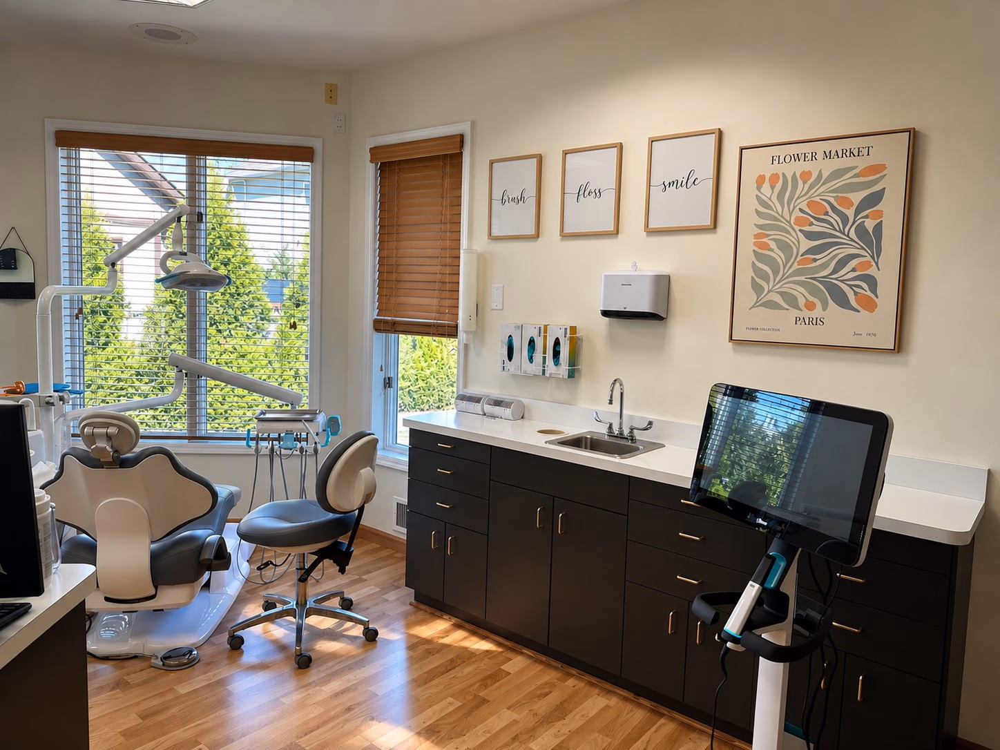Sunlit treatment room with an orthodontic chair and a digital scanner