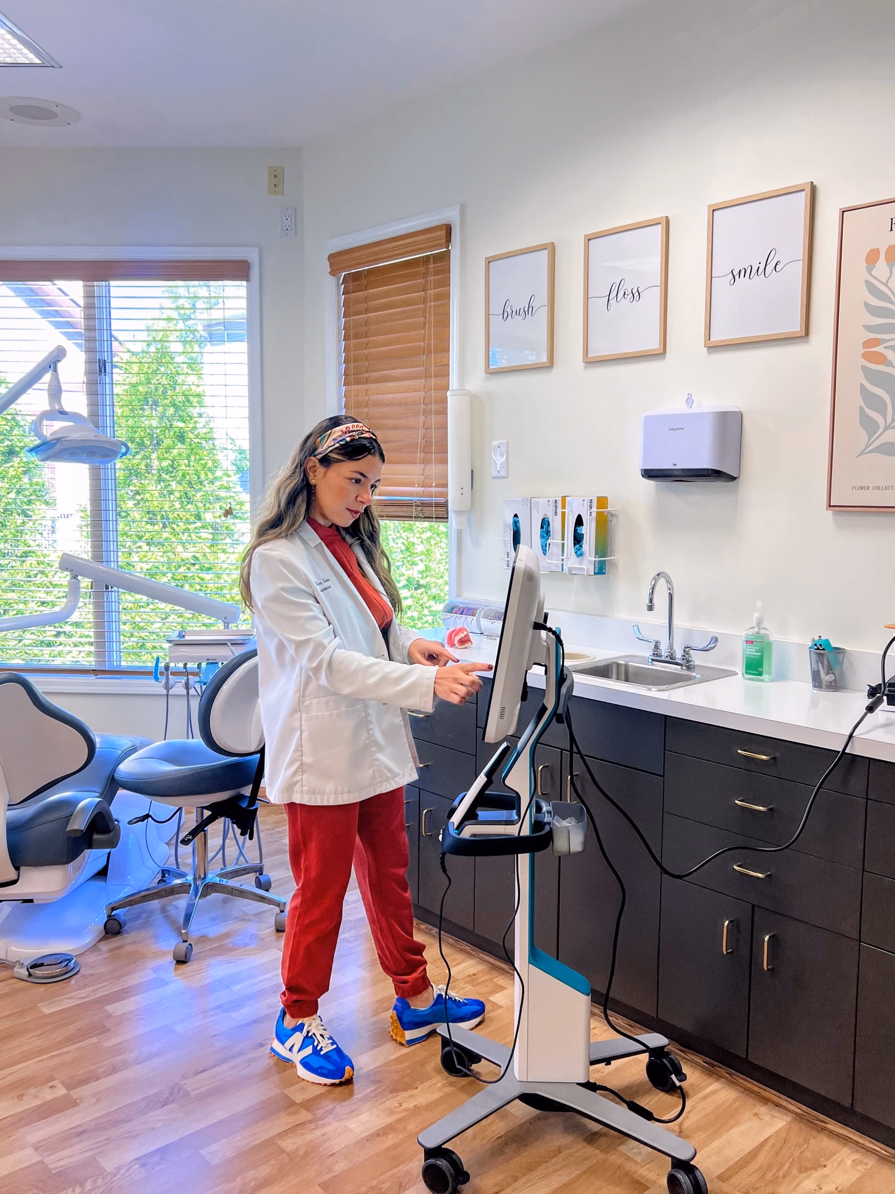 Dr. Eliana Sarit using the digital scanner in a treatment room