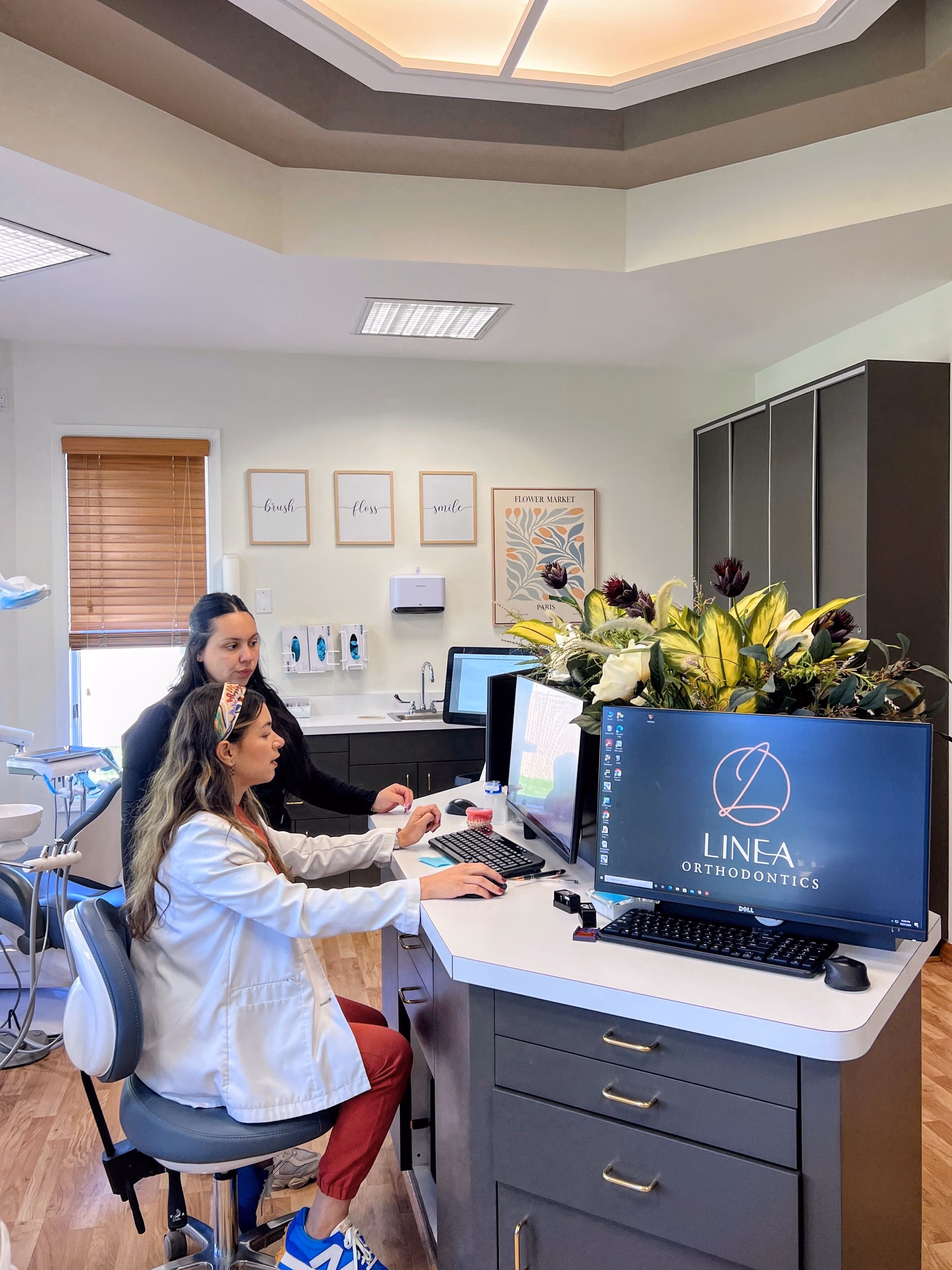 Dr. Eliana Sarit and a team member at the clinical workstation